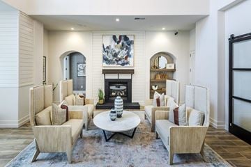 Huntersville apartment for rent - a living room with couches and chairs and a fireplace
