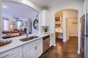 Huntersville apartment for rent - a kitchen with white cabinets and a sink and a refrigerator