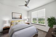 Atlanta apartment for rent - a bedroom with a large bed and a ceiling fan at Glenwood at Grant Park Apartments, Atlanta, Georgia