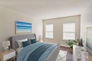 Quincy apartment for rent - a bedroom with a bed and two windows at Highlands at Faxon Woods, Quincy, Massachusetts