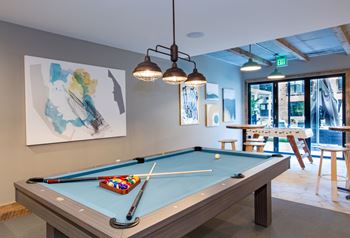 Game room with pool table and fuse ball table