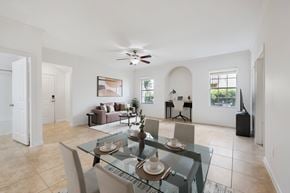 Ocala apartment for rent - A dining room with a glass table and chairs.