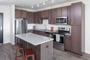 Rochester apartment for rent - Kitchen with Stainless Steel Appliances at Maven on Broadway Apartments, Rochester, MN, 55904
