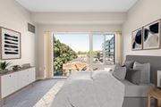 Manchester apartment for rent - a bedroom with a bed and a large window at the Residences at Manchester Place in Manchester, New Hampshire