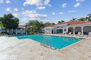 A swimming pool with a building in the background