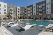 Macon apartment for rent - A pool area with a white sculpture in the middle of the pool.