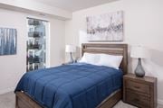 Rochester apartment for rent - Bedroom with bed at Maven on Broadway Apartments, Rochester, MN