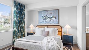 Port St. Lucie apartment for rent - A bedroom with a large bed and a painting of two birds on the wall. at Lucie at Tradition Apartments, Florida, 34987
