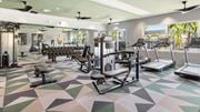 Port St. Lucie apartment for rent - A gym with a variety of equipment including treadmills, weights, and exercise machines. at Lucie at Tradition Apartments, Port St. Lucie, Florida