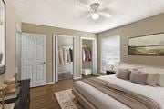 Corpus Christi apartment for rent - A bedroom with a large bed and a view of the ocean.