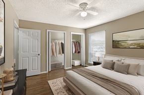 Corpus Christi apartment for rent - A bedroom with a large bed and a view of the ocean.