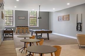 Enfield apartment for rent - A community game room with a pool table and chairs.