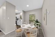 Austin apartment for rent - A dining room with a table set for two and a view of the backyard.