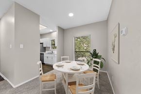 Austin apartment for rent - A dining room with a table set for two and a view of the backyard.
