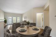 Fort Myers apartment for rent - A dining room with a round table surrounded by chairs.