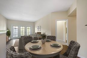 Fort Myers apartment for rent - A dining room with a round table surrounded by chairs.