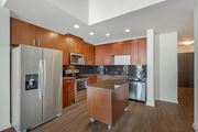 Tampa apartment for rent - A kitchen with wooden cabinets and stainless steel appliances