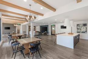 Alpharetta apartment for rent - A modern dining room with a long table and chairs.