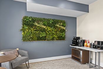 Business center with individual work spaces and coffee station