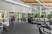Quincy apartment for rent - A gym with a variety of equipment including treadmills, weights, and exercise machines.