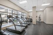 Hartford apartment for rent - A gym with treadmills and a view of the outside.
