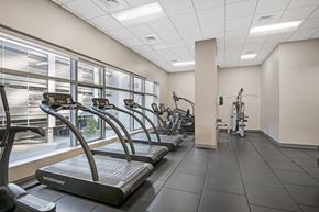 Hartford apartment for rent - A gym with treadmills and a view of the outside.