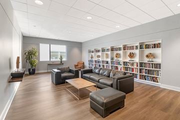 Hartford apartment for rent - A living room with a large bookshelf filled with books.
