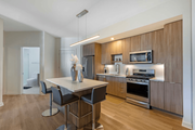 Chamblee apartment for rent - A modern kitchen with a dining table and chairs.