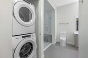 Chamblee apartment for rent - A white Whirlpool washing machine in a laundry room.