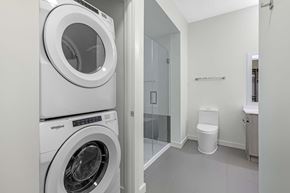 Chamblee apartment for rent - A white Whirlpool washing machine in a laundry room.