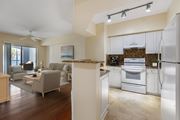 Boynton Beach apartment for rent - A modern kitchen with an open concept layout that opens up into the living room