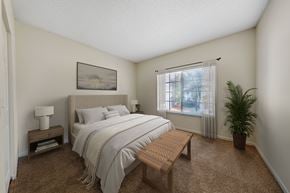 Boynton Beach apartment for rent - A bedroom with a bed, nightstand, and window.
