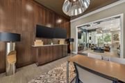 Land O Lakes apartment for rent - A modern office space with a reception desk and a large mirror on the wall.