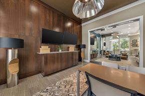 Land O Lakes apartment for rent - A modern office space with a reception desk and a large mirror on the wall.