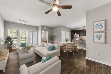 Land O Lakes apartment for rent - A living room with a white couch and a ceiling fan.
