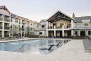 Charleston apartment for rent - A large swimming pool in front of a resort style building at Wharf 7 Apartments, Charleston, SC