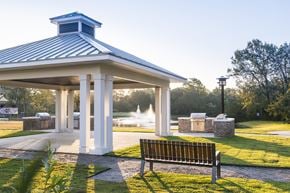 Charleston apartment for rent - A gazebo with a fountain in the background and a bench in the foreground at Wharf 7 Apartments, Charleston, South Carolina