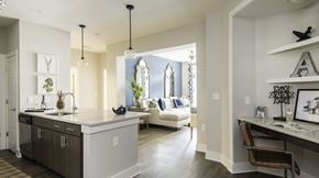 Charleston apartment for rent - A kitchen with a white counter and a brown chair at Wharf 7 Apartments, South Carolina
