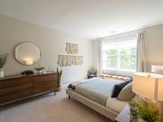 Merrimack apartment for rent - a bedroom with a bed, dresser,  and a window at Edgebrook Residences, New Hampshire