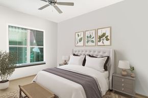 Orlando apartment for rent - a bedroom with white walls and a large window with blinds at The Rialto, Orlando