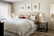 Charlotte apartment for rent - A bedroom with a large bed and a window with curtains.