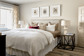 Charlotte apartment for rent - A bedroom with a large bed and a window with curtains.