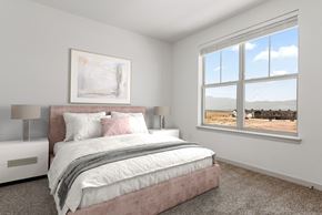 Colorado Springs apartment for rent - A bedroom with a large bed and a painting on the wall.