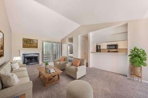 Austin apartment for rent - Living room with a fireplace and couches at Great Hills, Austin, TX