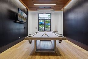 Waltham apartment for rent - a game room with a ping pong table and a window at The Merc, Waltham, Massachusetts