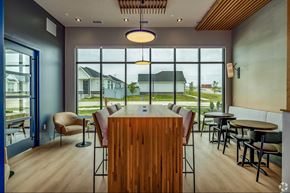 Elkhorn apartment for rent - A modern dining room with a wooden table and chairs.