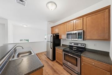 Albany apartment for rent - A kitchen with wooden cabinets and stainless steel appliances.
