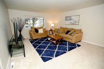 Latham apartment for rent - a living room with two couches and a coffee table