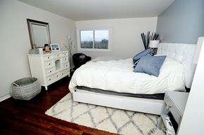 Latham apartment for rent - a bedroom with a bed and a dresser and a window