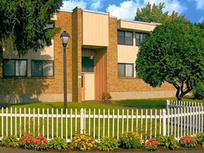 Latham apartment for rent - an apartment building with a white fence